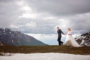 JB Haygood photography couple walking on edge of mountain