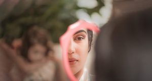 Photos by Clay - Bride looking at herself in the mirror - Forever Bridal Wedding Shows