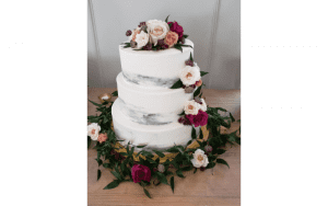 Edible Art Raleigh NC White 3 tier- white cake with pink and burgundy flowers