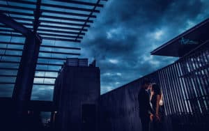 Azul Photography Raleigh NC Forever & Company cloudy weather dark image of couple standing outside