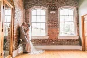Wedding Kiss captured by One Crazy Love Photography