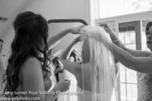 Your Still Life Photography Bride putting on veil
