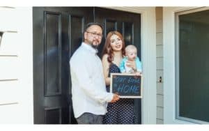 Old Mill Group Real Estate Couple celebrating first home with baby