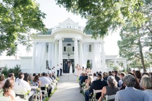 Will Greene Photography - Bride and Groom saying vows during ceremony on front portch of historic house in Raleigh, NC - Forever Bridal Wedding Shows
