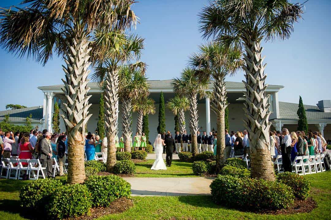 Ceremony surrounded by palm trees - Merrell Estate & Gardens - Forever Bridal Wedding Shows