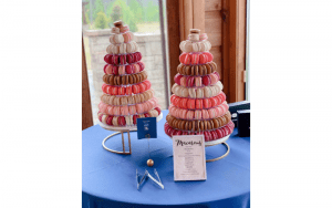 Mon Macaron two tiered cakes on display in pink white and brown colors