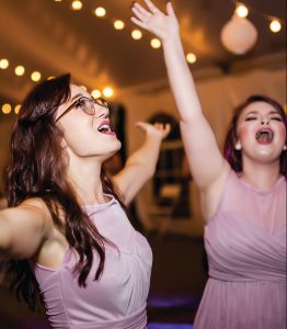 Dow Oak Events two bridesmaids dancing and singing to music