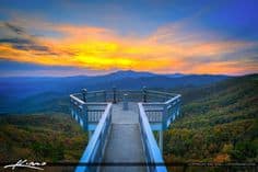 Photo of couple at North Carolina Blue Ridge Parkway - walkway with sunset and blue mountains