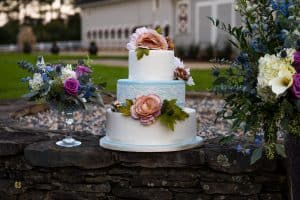 Wakefield Barn - white and blue wedding cake with pink flowers - confectionate cakes - forever bridal wedding shows