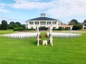 River Ridge Golf Club - White Ceremony Chairs on Front Lawn in front of Club House - Forever Bridal Wedding Shows