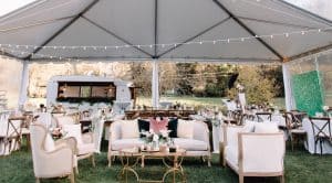 Lily Rose Events outdoor couch and chair seating underneath tent