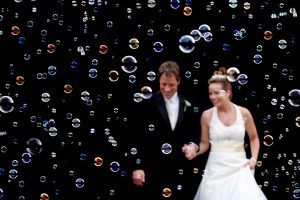 Azul Photography Couple surrounded by bubbles as favors
