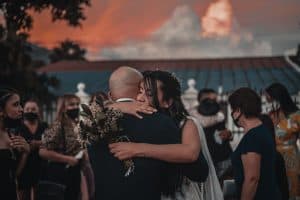 Forever & Company blog post bride hugging man at sunset