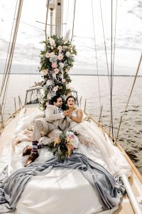 FauxReal Flowres Bride and Groom on Sailboat with beautiful Floral arrangement