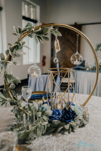 A circular golden centerpiece in the middle of a table. 