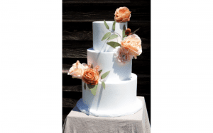 Banko Bake three tiered white cake with orange roses