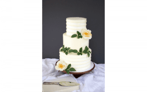 Banko Bake three tiered white came with white and orange flowers
