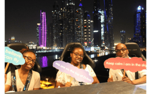 Bucket List Moments Travel family holding signs in Dubai