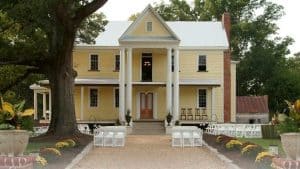 The Timberlake house is the picturesque backdrop for the ceremony and the walkway lined with guest seating.