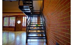 The Story Event Venue Chapel Hill, NC black staircase leading from Ballroom to Rooftop