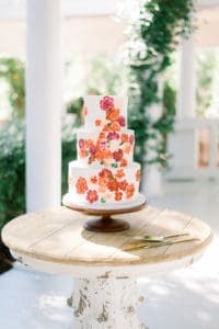 Banko Bakes wedding cake - white with coral flowers.