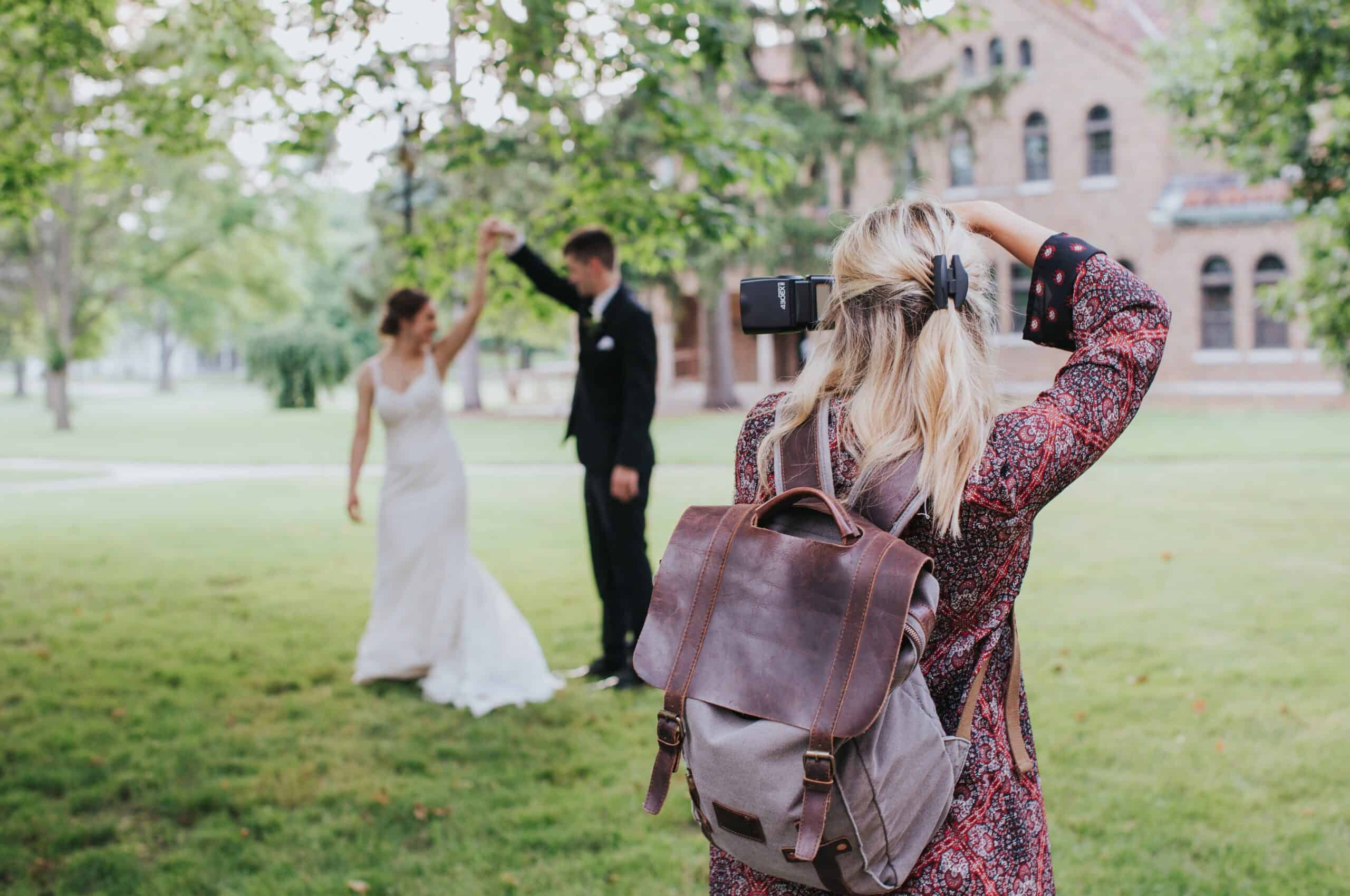 wedding photographer taking picture of a couple