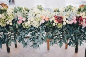 Line of Wedding Bouquets and Greenery